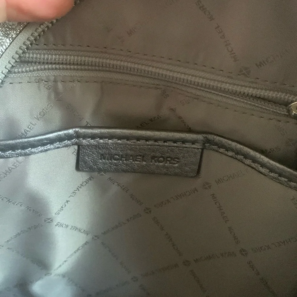 Michael Kors Silver shimmer Monogram Backpack shiny zipper leather compartments‎
